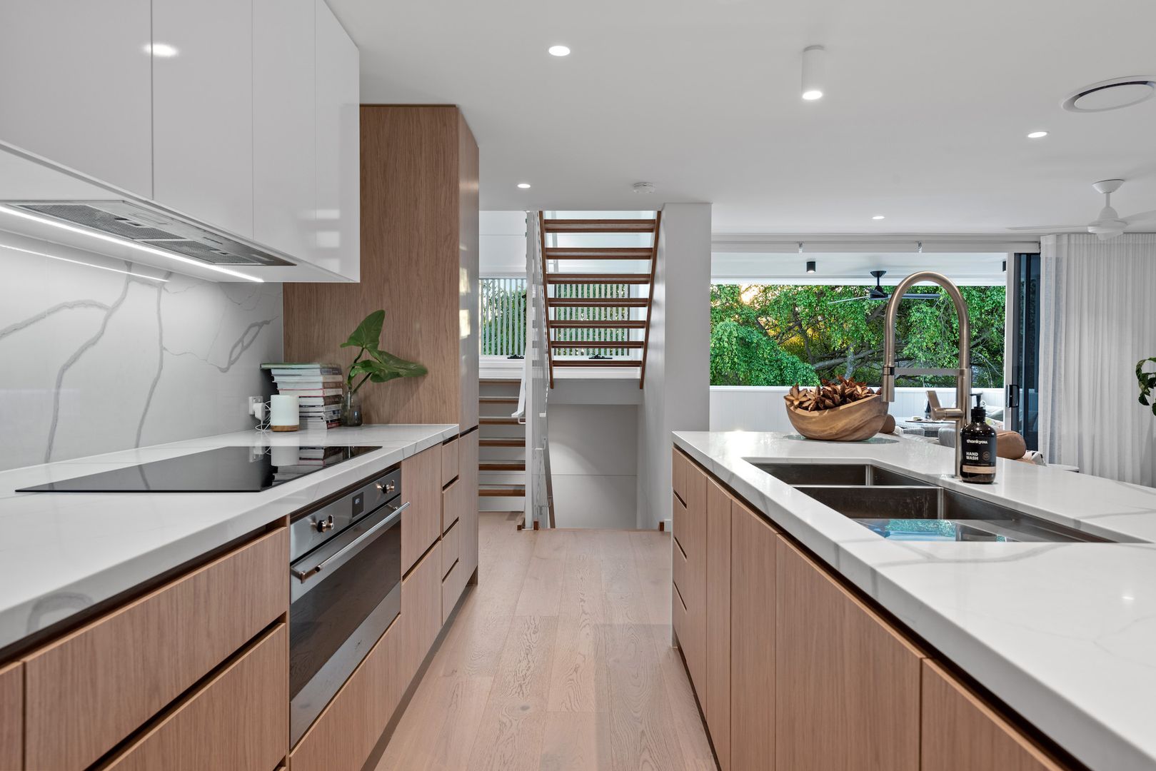 Close-up view of the kitchen at Warilda Street Terraces, featuring a central island and sleek cabinetry