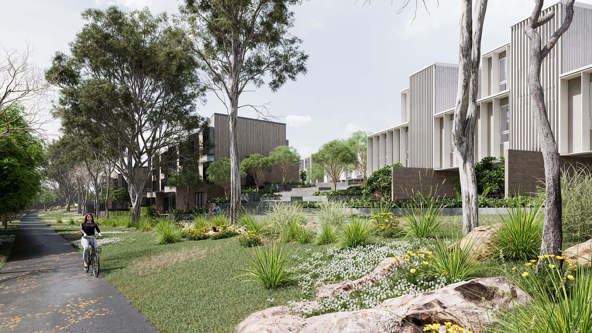 View of townhomes nestled within sub-tropical landscaping at Old Logan Village Road Development